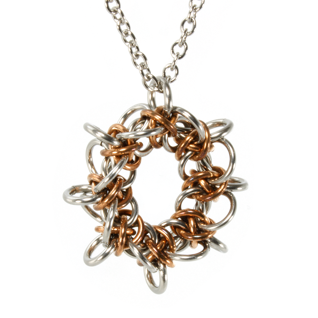 A bronze and steel triffids chainmaille pendant.