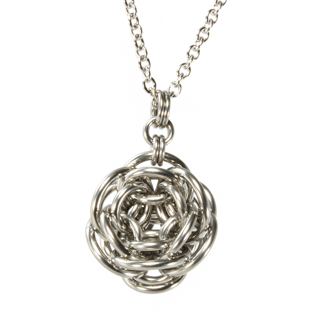 A steel rhosyn chainmaille pendant.