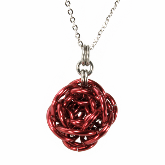 A red aluminum rhosyn chainmaille pendant.
